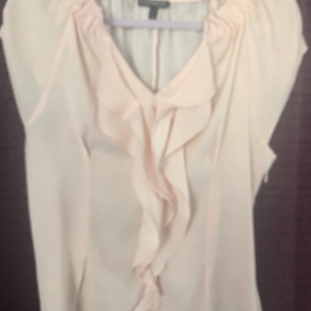 Express light peach ruffled blouse.